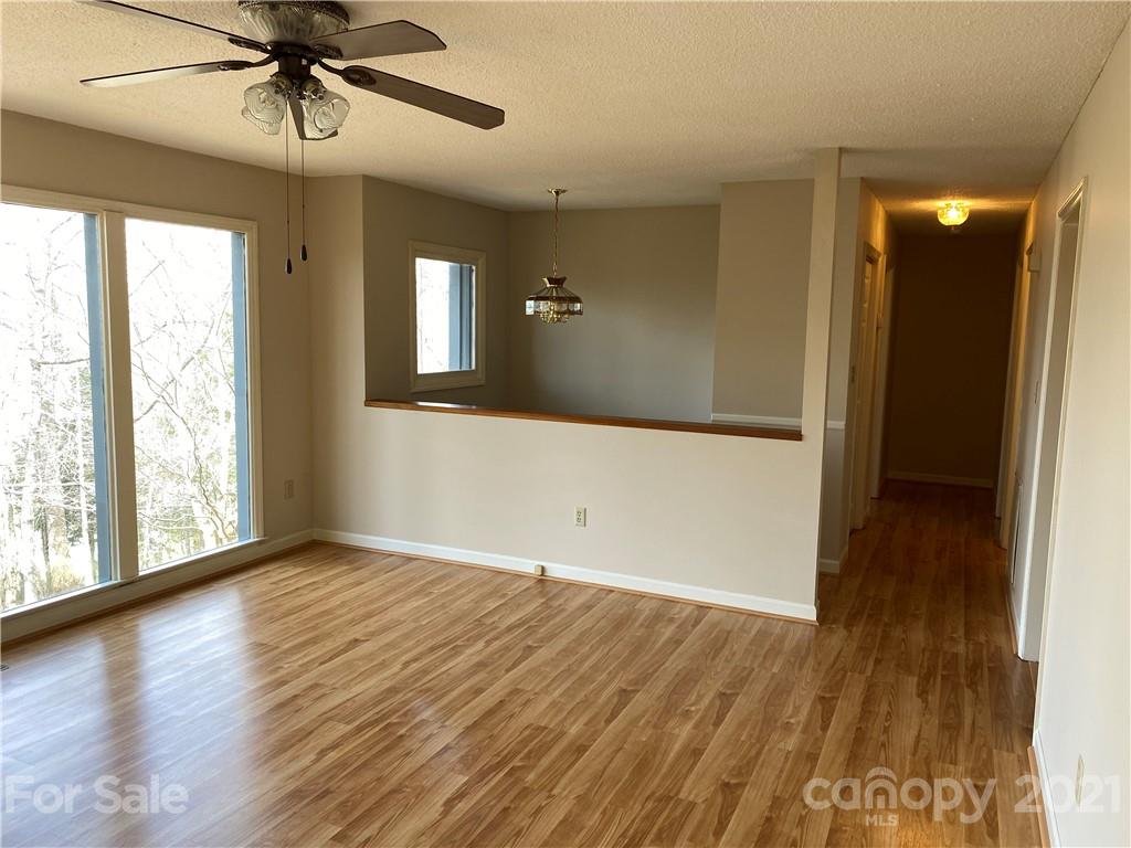 126 Burma Road West Marion, NC 28752 - Photo 13 of 29 wooden floor in an empty room with a window