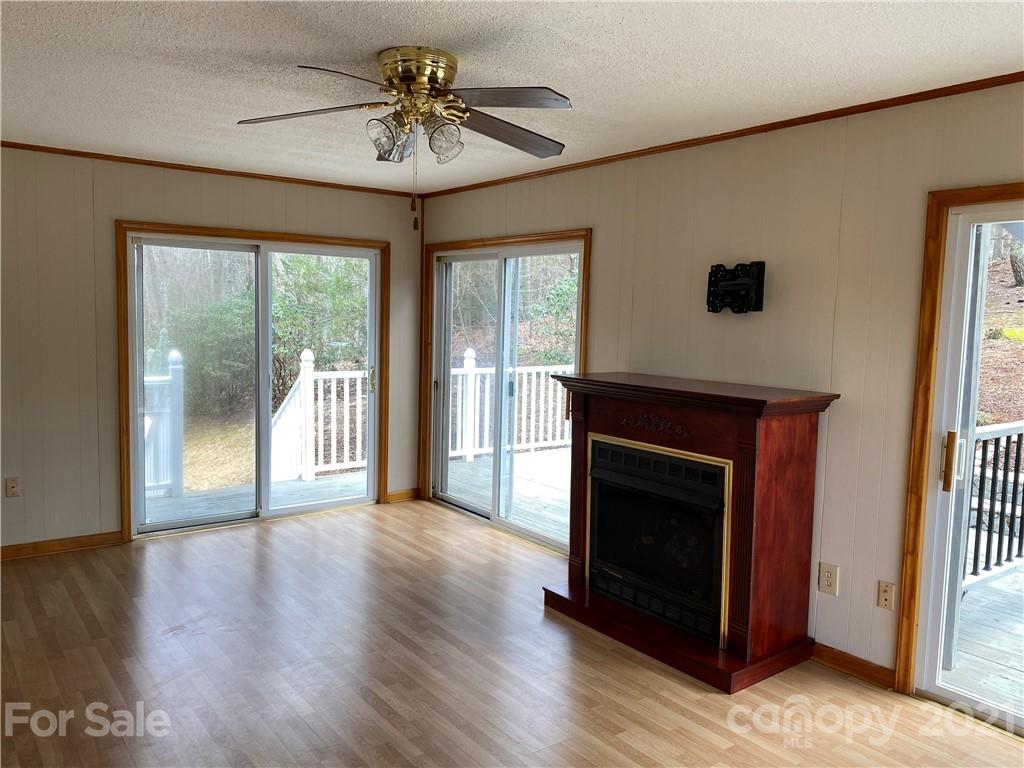126 Burma Road West Marion, NC 28752 - Photo 21 of 29 a view of an empty room with glass door and a window