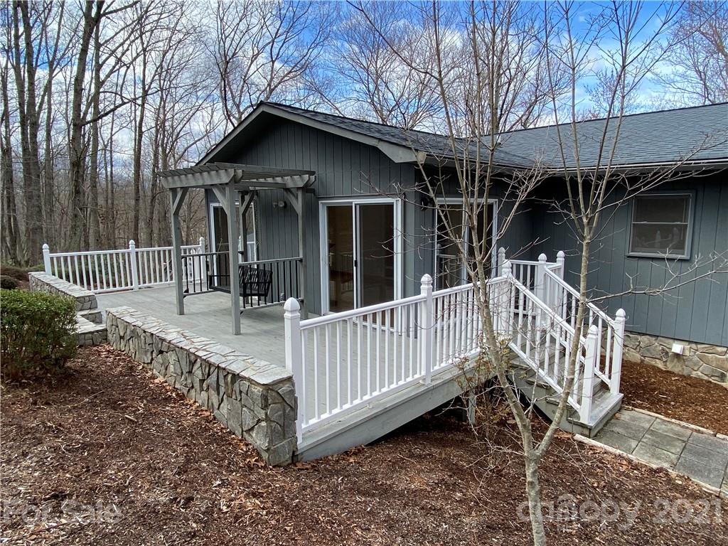 126 Burma Road West Marion, NC 28752 - Photo 5 of 29 a view of a house with a yard and wooden fence