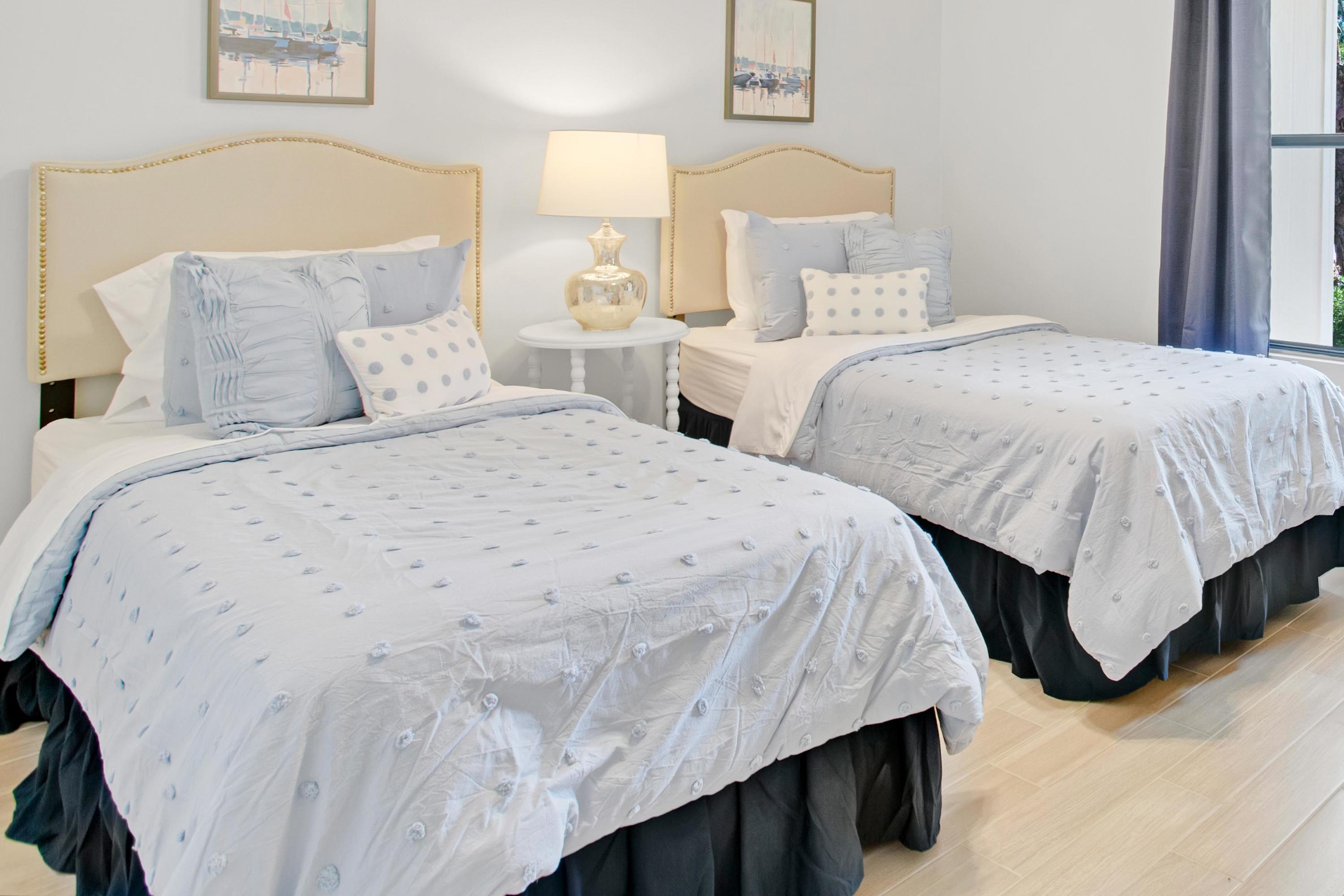 666 Bayou Drive, Unit 666 Miramar Beach, FL 32550 - Photo 16 of 24 a bedroom with two beds and painting on the wall