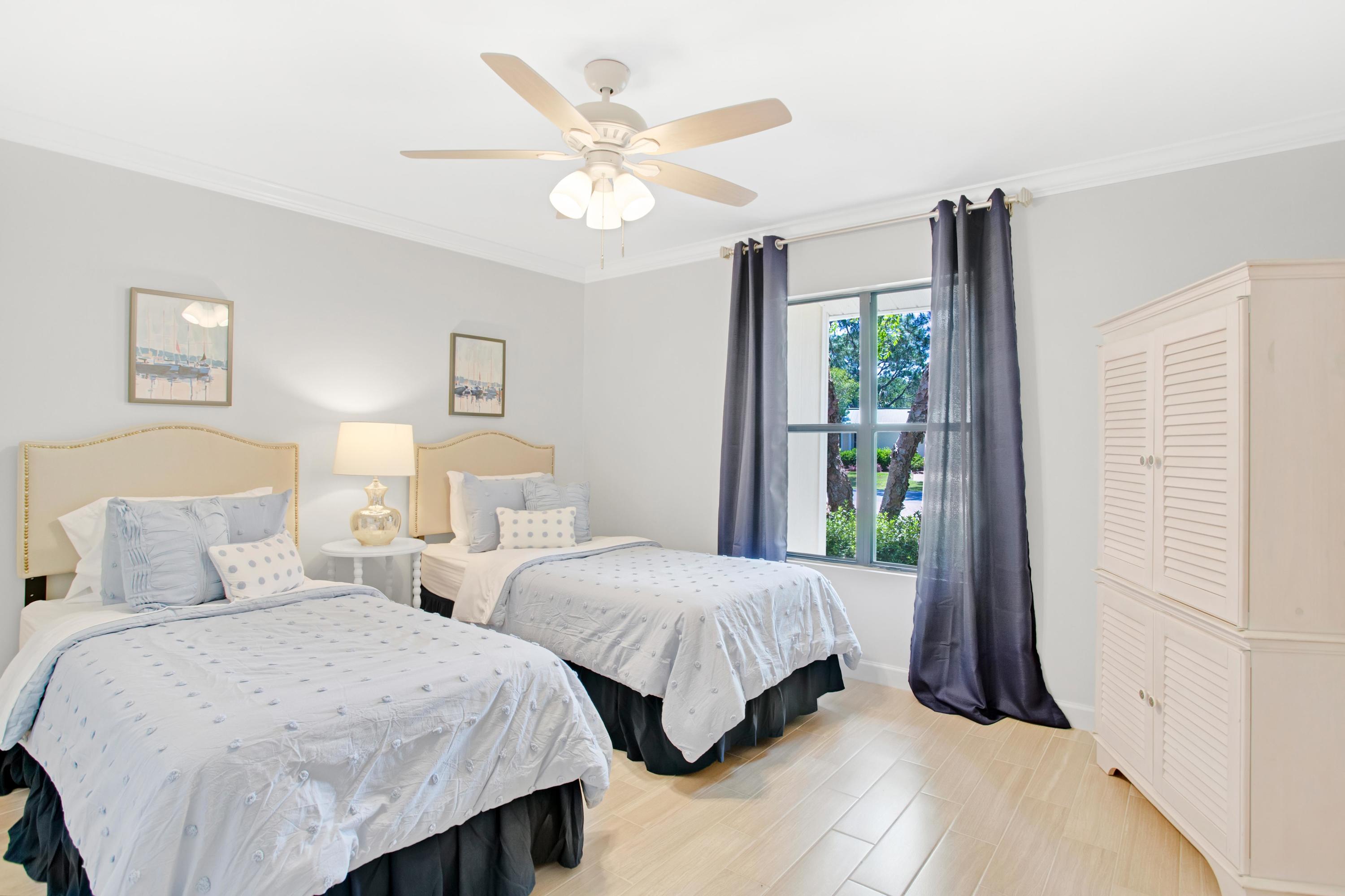 666 Bayou Drive, Unit 666 Miramar Beach, FL 32550 - Photo 18 of 24 a bedroom with two beds and a large window