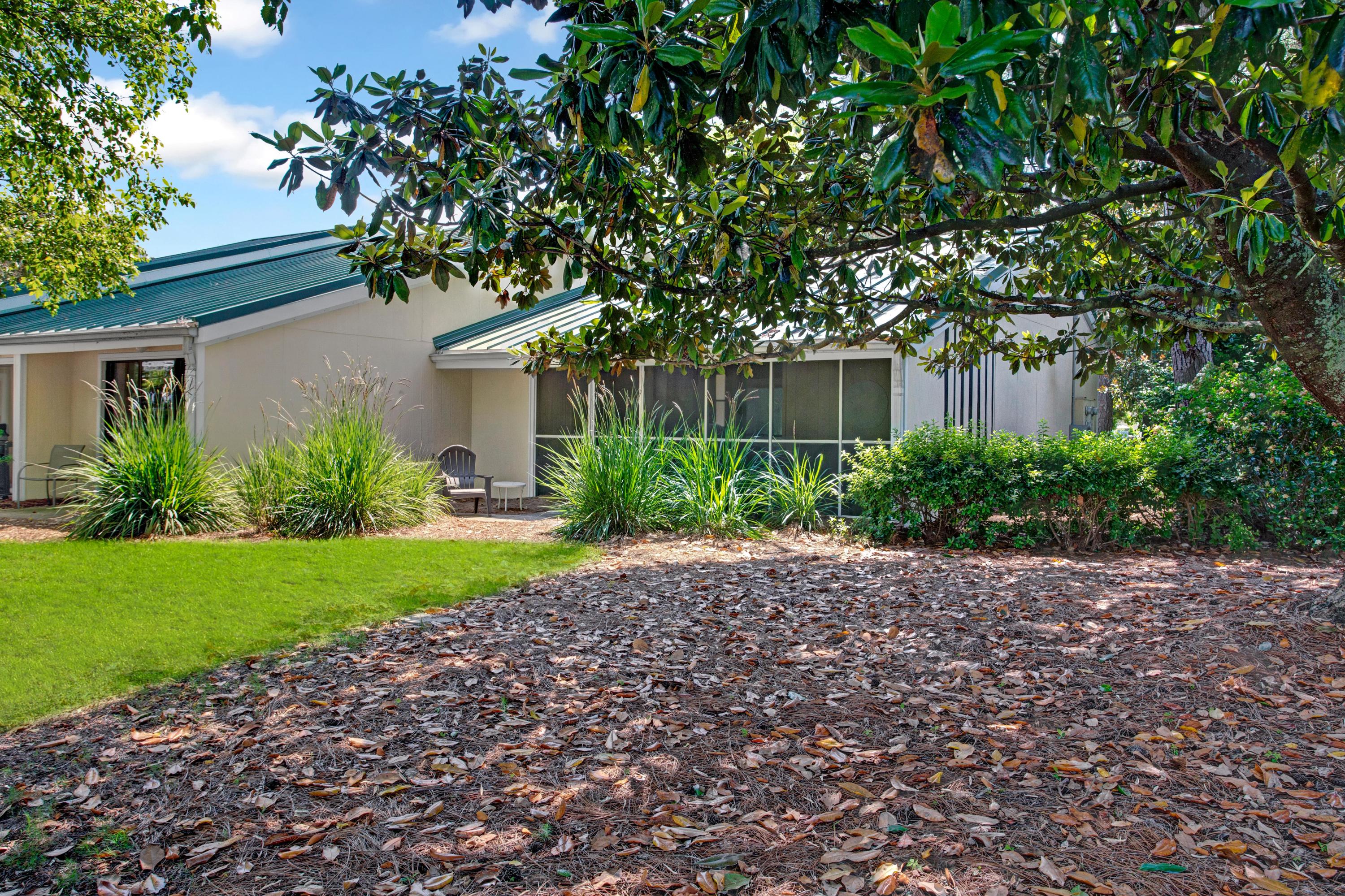 666 Bayou Drive, Unit 666 Miramar Beach, FL 32550 - Photo 23 of 24 a house with a tree in front of it