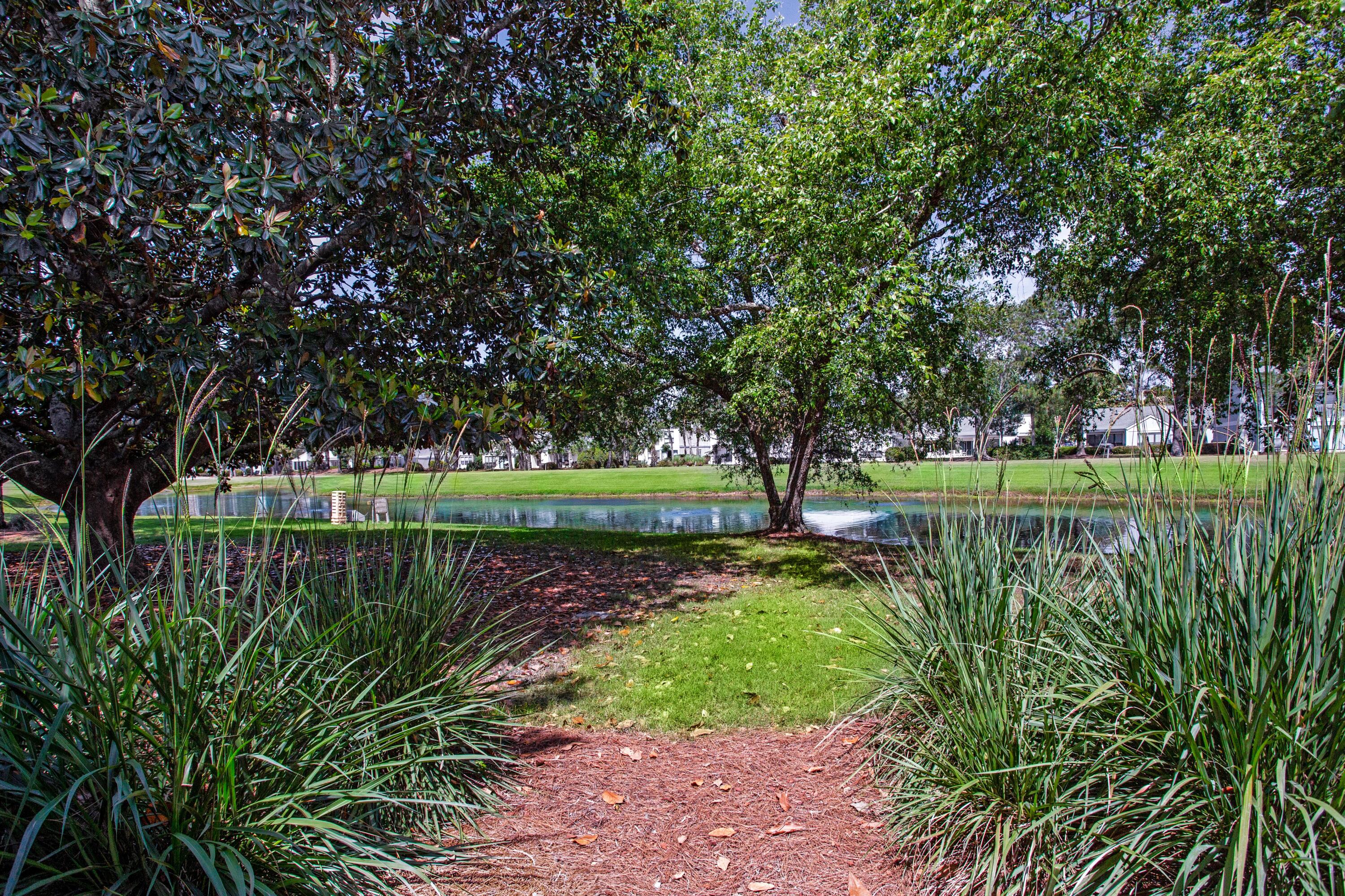 666 Bayou Drive, Unit 666 Miramar Beach, FL 32550 - Photo 24 of 24 a view of a lake with a bridge