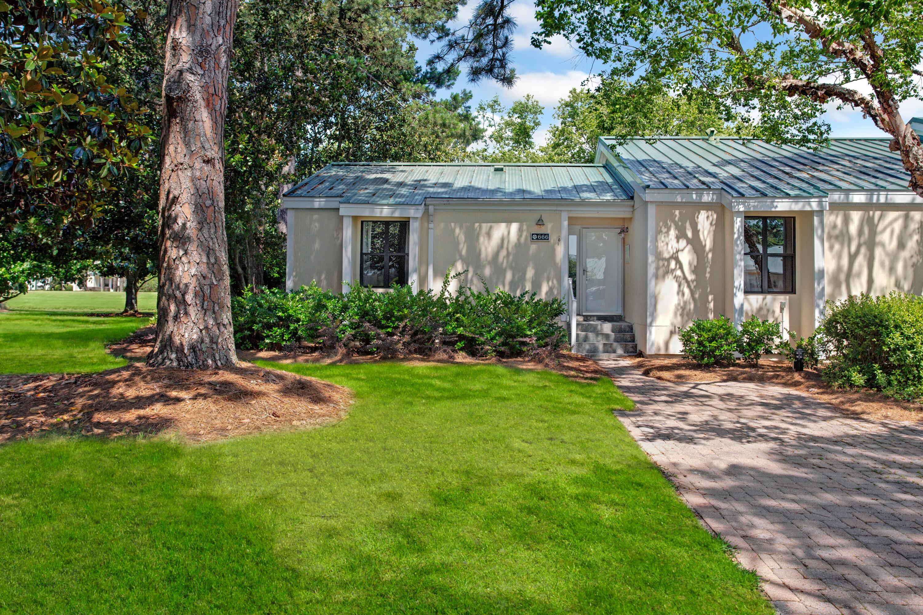 666 Bayou Drive, Unit 666 Miramar Beach, FL 32550 - Photo 3 of 24 front view of a house with a yard