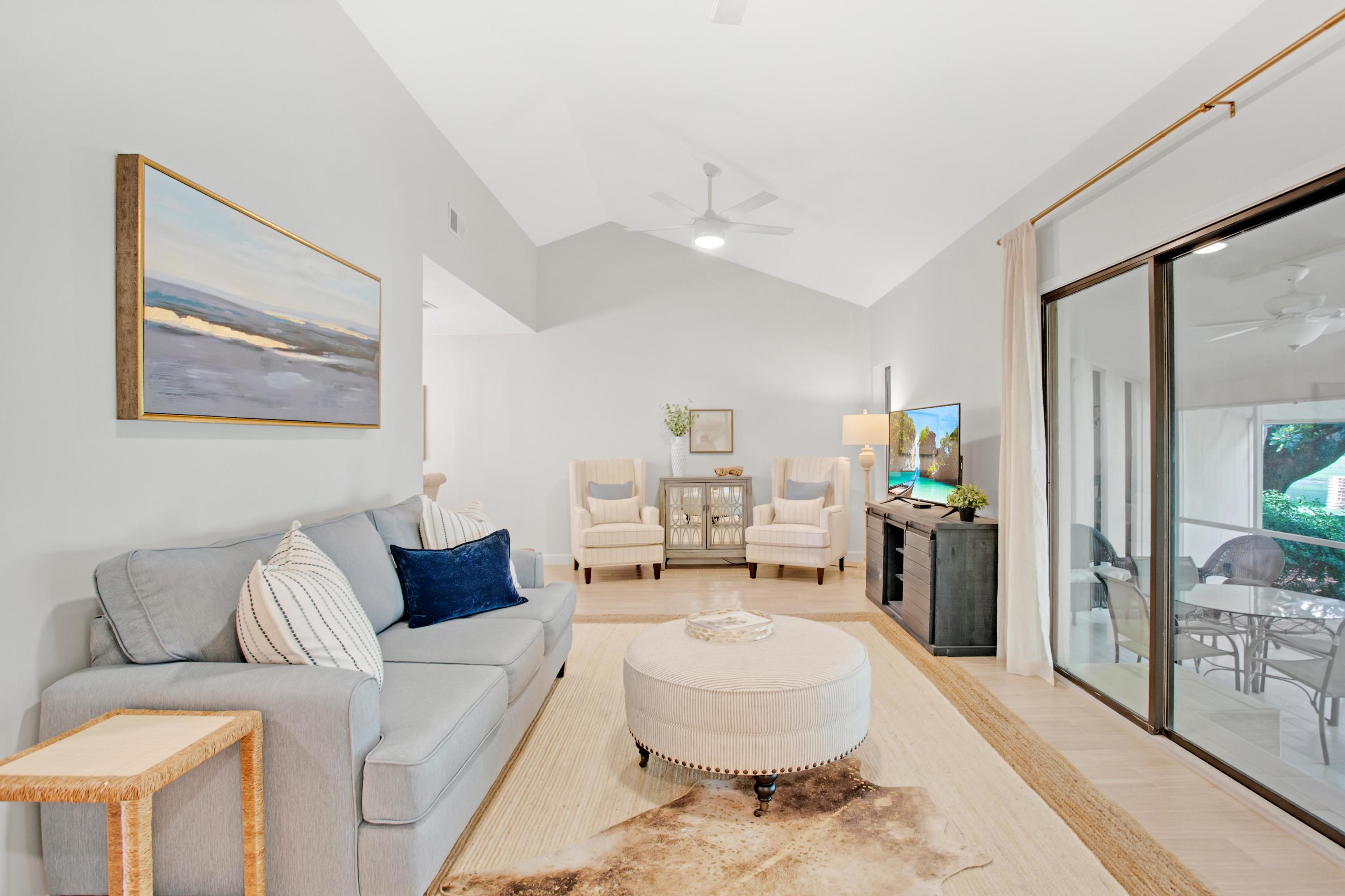 666 Bayou Drive, Unit 666 Miramar Beach, FL 32550 - Photo 5 of 24 a living room with furniture and a rug
