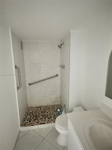 a bathroom with a bathtub and shower