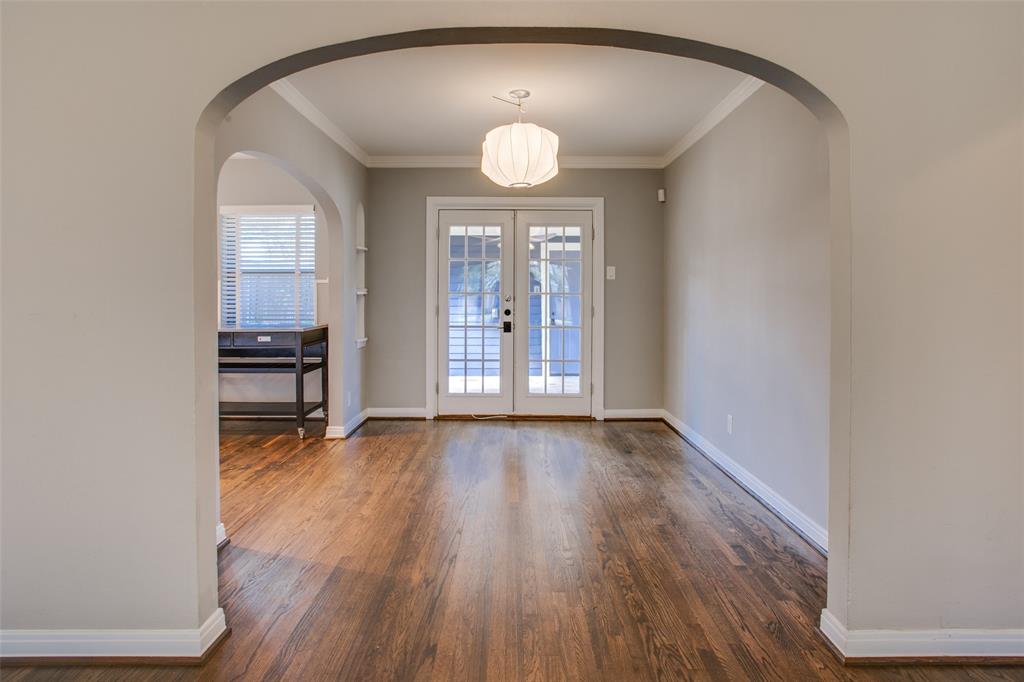 2051 Marydale Road Dallas, TX 75208 - Photo 12 of 30 an empty room with wooden floor and windows
