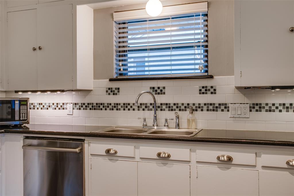 2051 Marydale Road Dallas, TX 75208 - Photo 16 of 30 a kitchen with a sink and a white cabinets