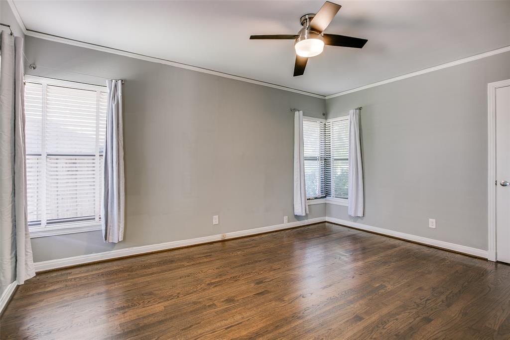 2051 Marydale Road Dallas, TX 75208 - Photo 20 of 30 a view of an empty room with wooden floor and a window
