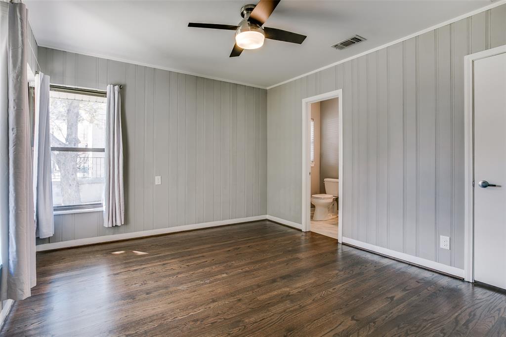 2051 Marydale Road Dallas, TX 75208 - Photo 24 of 30 a view of an empty room with wooden floor and a window