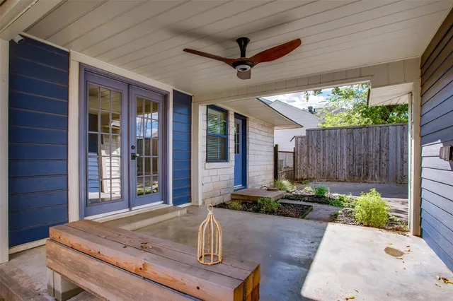 a view of a backyard with large trees