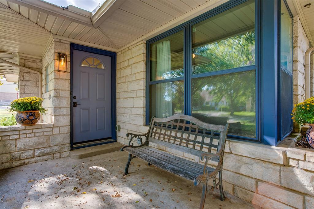 2051 Marydale Road Dallas, TX 75208 - Photo 3 of 30 a bench sitting in front of a building