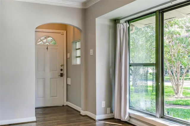 a view of front door with wooden floor