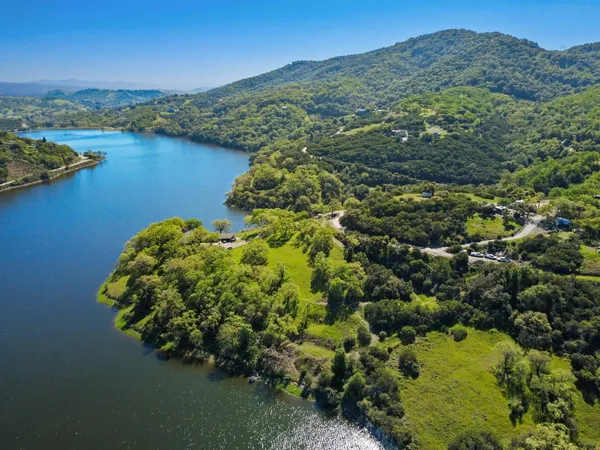 a aerial view of a house with a lake view