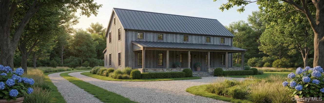 1000 Rocky Point Road East Marion, NY 11939 - Photo 6 of 14 a front view of a house with a garden and plants