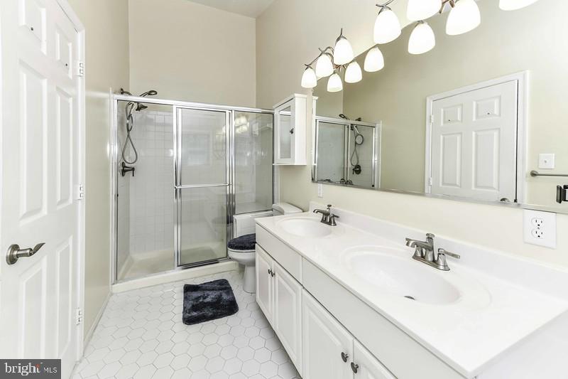 2 Parker Farm Court Silver Spring, MD 20906 - Photo 29 of 34 a bathroom with a sink a toilet and a mirror