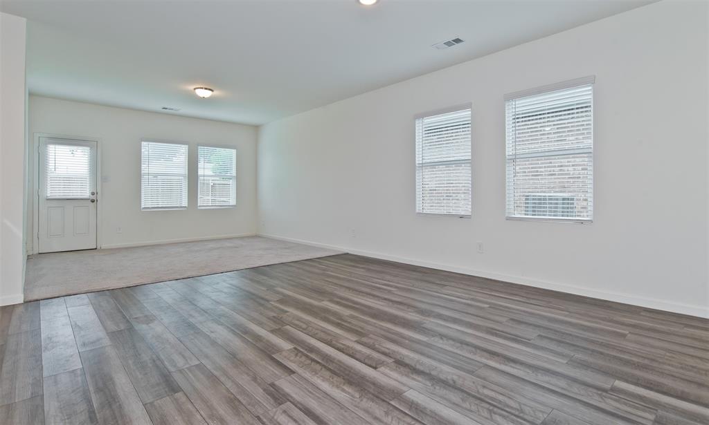 1637 Shadow Hawk Drive Fort Worth, TX 76052 - Photo 10 of 20 an empty room with wooden floor and windows