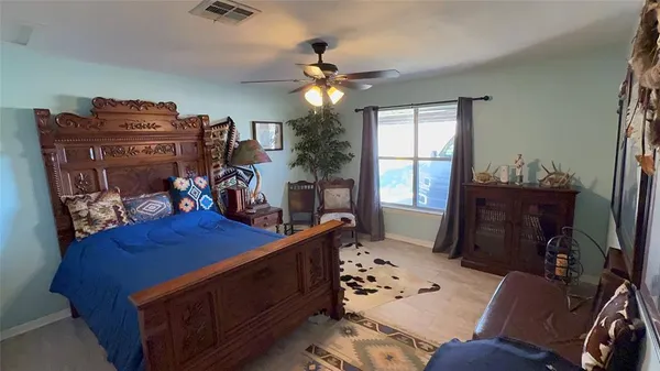a bed room with a bed and a chandelier