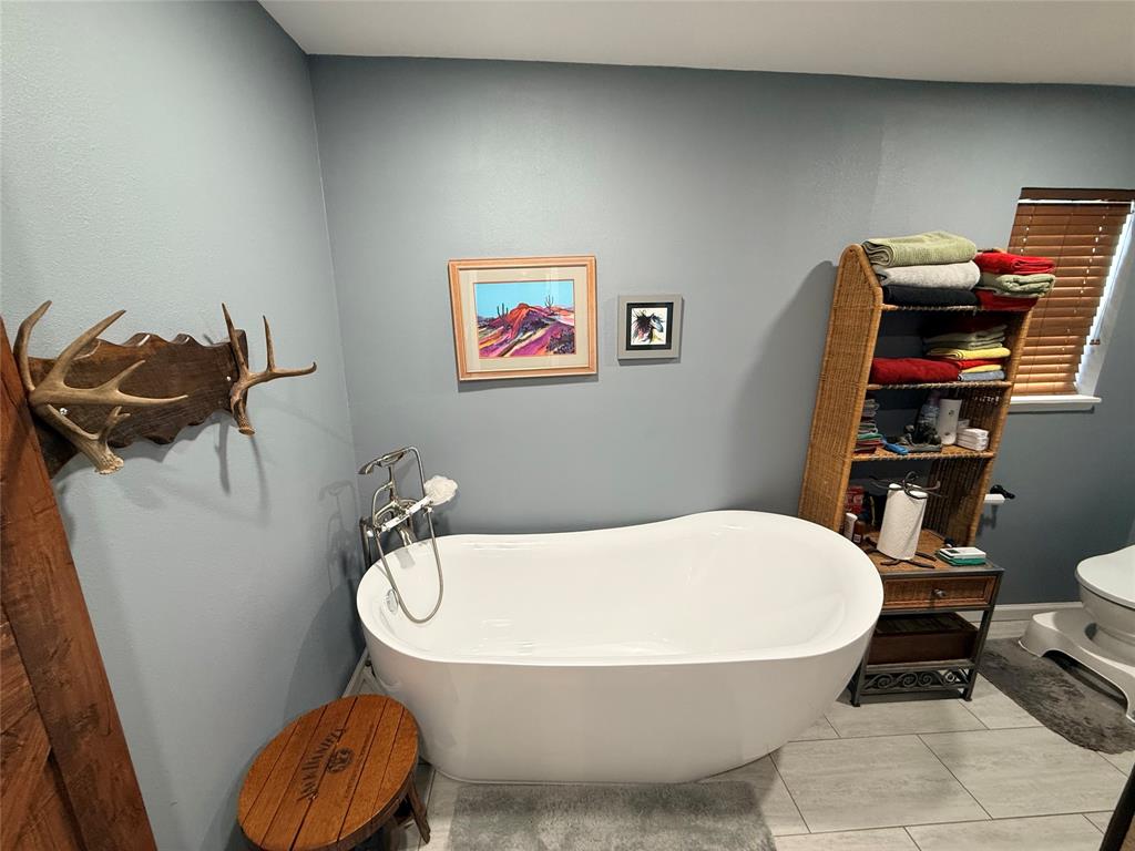 351 Bosque Bend Lane China Spring, TX 76633 - Photo 19 of 39 a bathroom with a sink and a toilet
