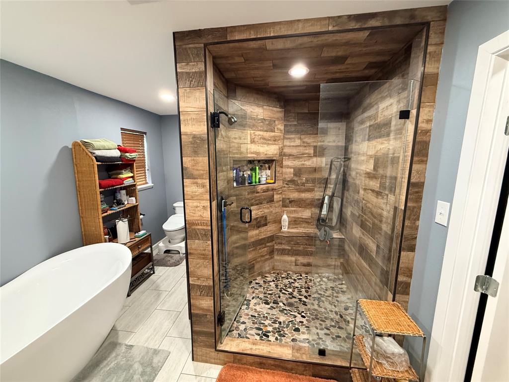 351 Bosque Bend Lane China Spring, TX 76633 - Photo 21 of 39 a bathroom with a bathtub and a shower