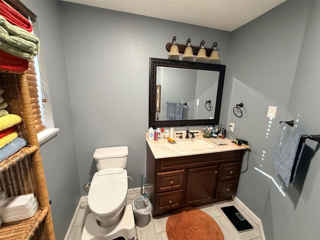 351 Bosque Bend Lane China Spring, TX 76633 - Photo 23 of 39 a bathroom with a toilet a sink and mirror