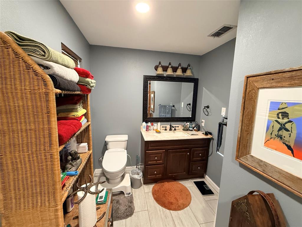 351 Bosque Bend Lane China Spring, TX 76633 - Photo 24 of 39 a bathroom with a toilet sink and mirror