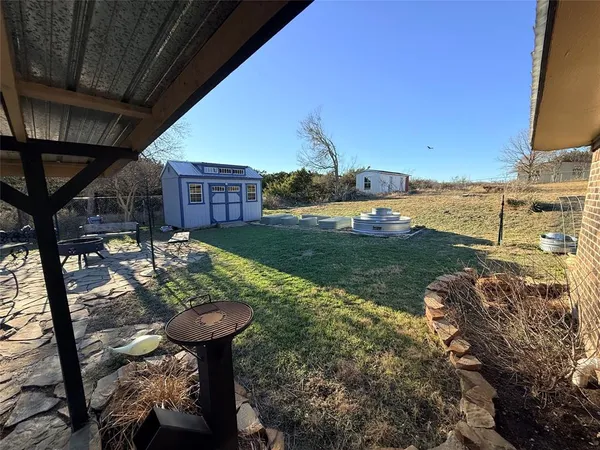 a view of a backyard with plants