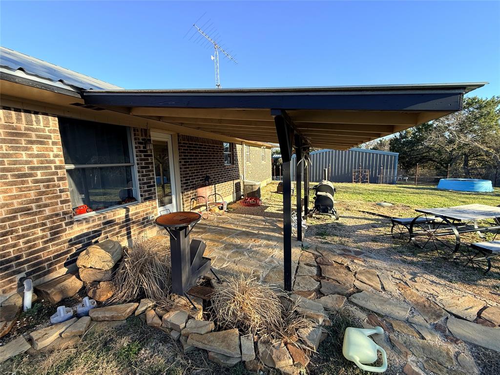351 Bosque Bend Lane China Spring, TX 76633 - Photo 26 of 39 a view of a backyard with two chairs and a table