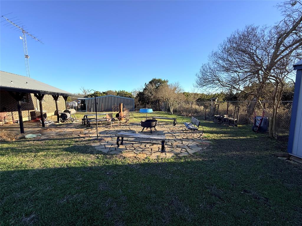 351 Bosque Bend Lane China Spring, TX 76633 - Photo 28 of 39 a swimming pool with outdoor seating and yard