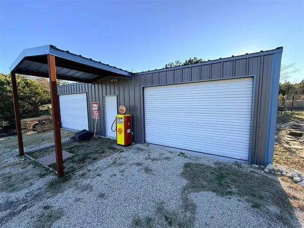 a bed sitting in a room next to a building