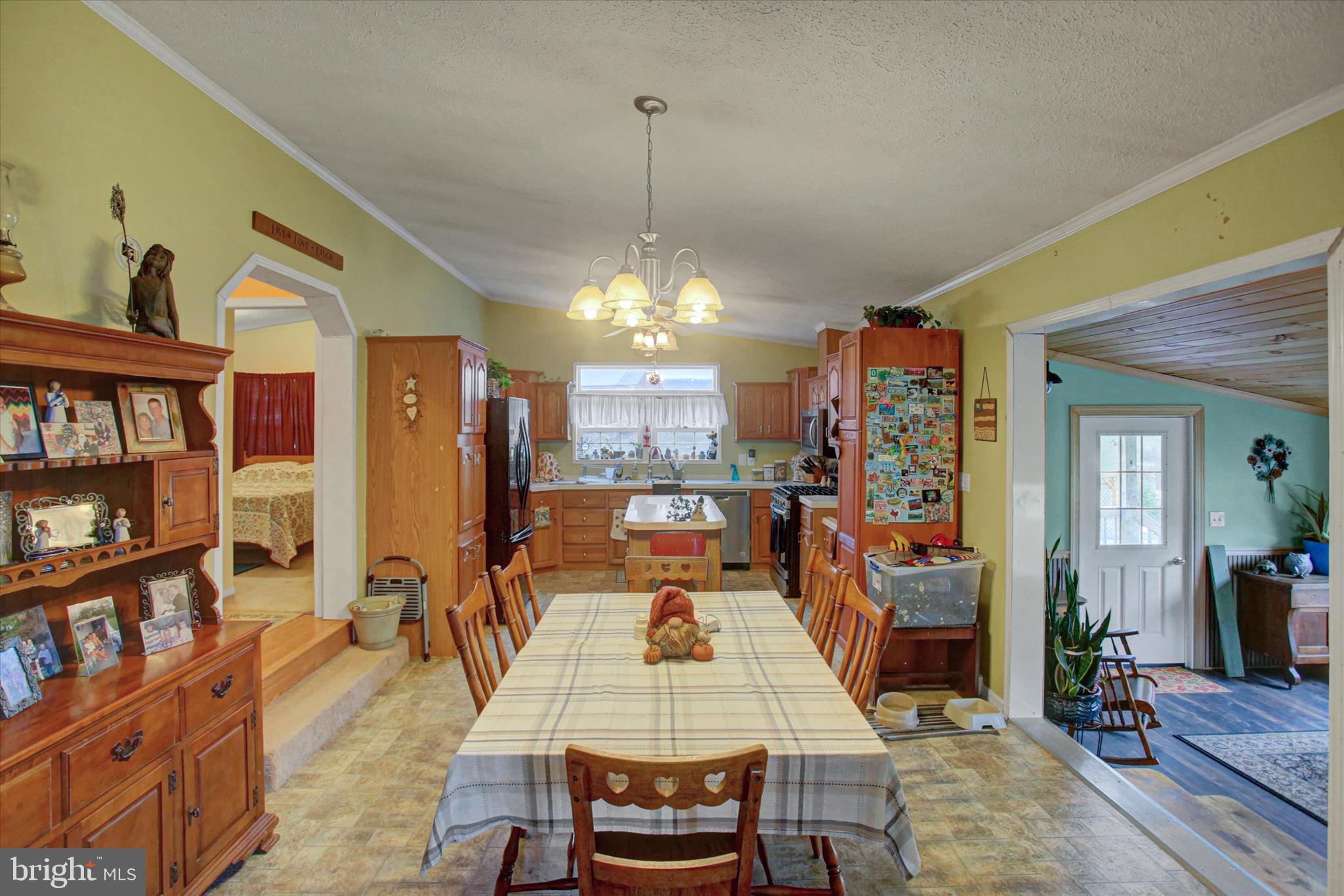 21571 Path Valley Road Dry Run, PA 17220 - Photo 13 of 63 a dining room with furniture and a chandelier