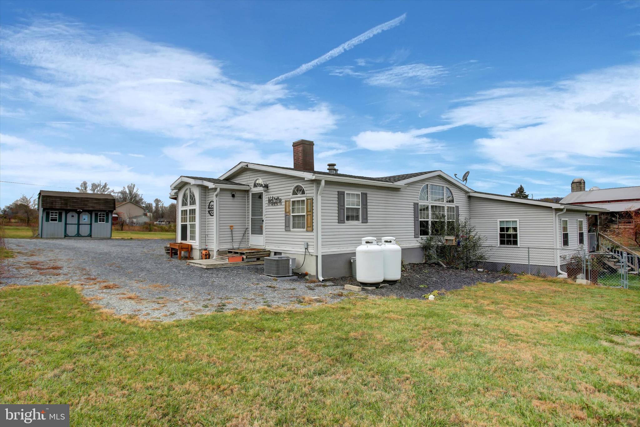 21571 Path Valley Road Dry Run, PA 17220 - Photo 3 of 63 a view of a house with backyard porch and sitting area