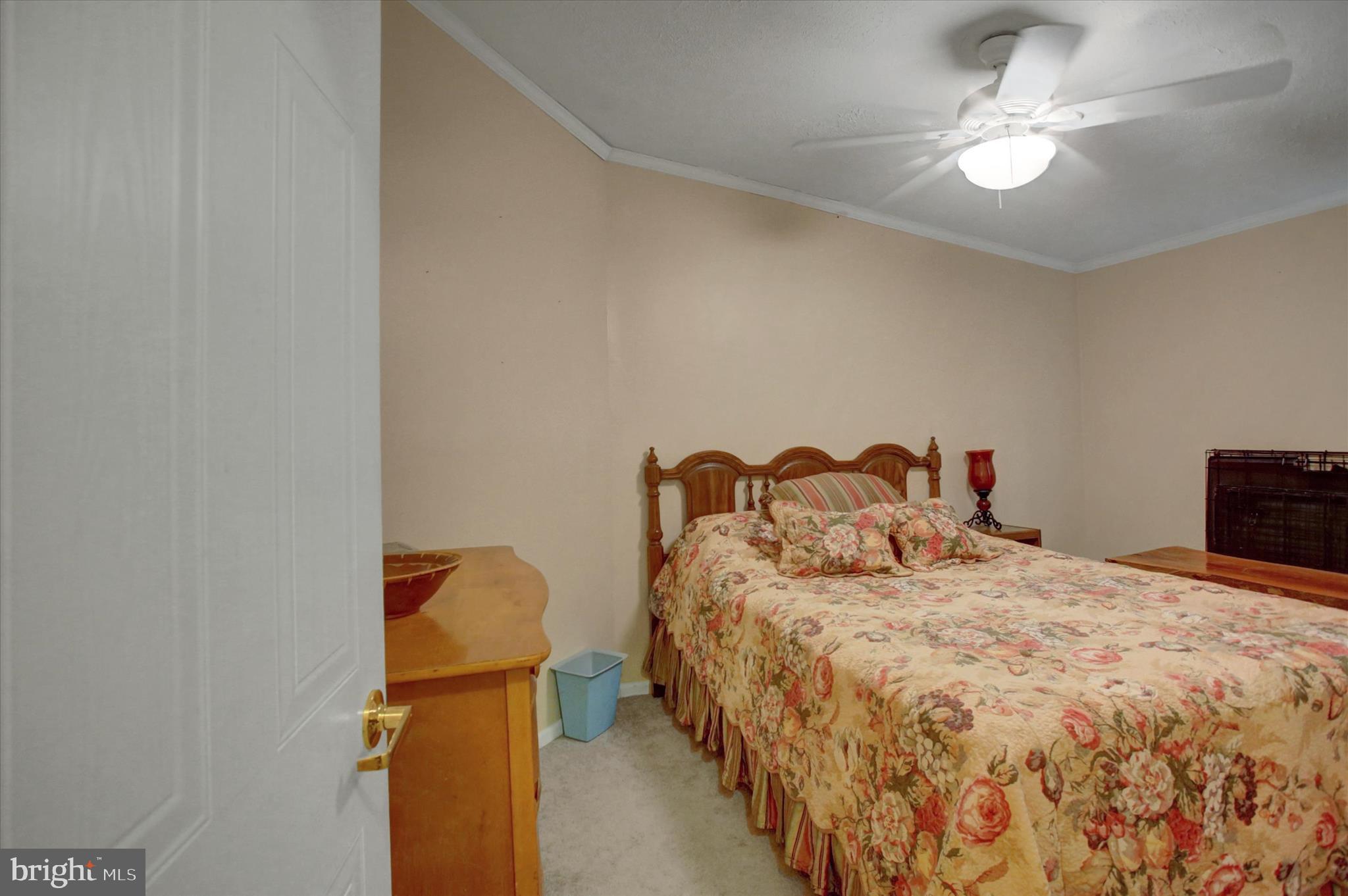 21571 Path Valley Road Dry Run, PA 17220 - Photo 32 of 63 a bedroom with a bed and a chandelier