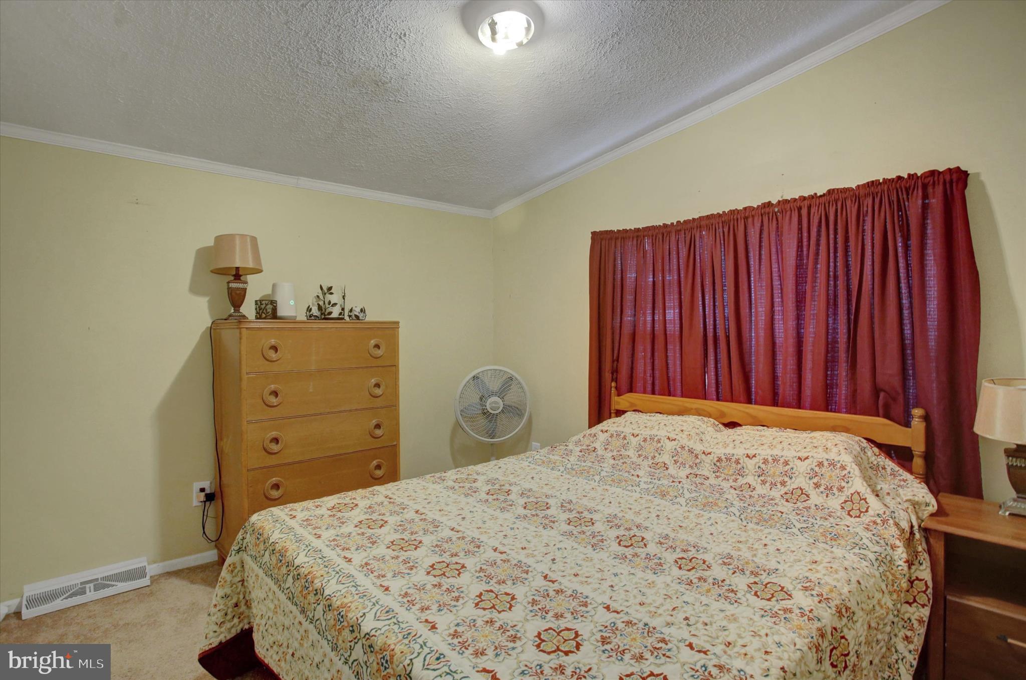 21571 Path Valley Road Dry Run, PA 17220 - Photo 34 of 63 a bedroom with a bed and a dresser