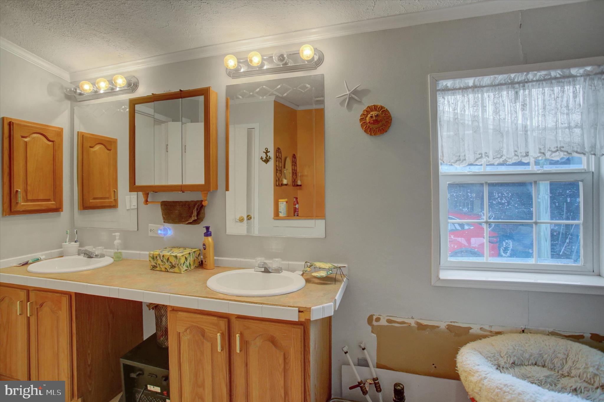 21571 Path Valley Road Dry Run, PA 17220 - Photo 37 of 63 a bathroom with double vanity sinks and a mirror