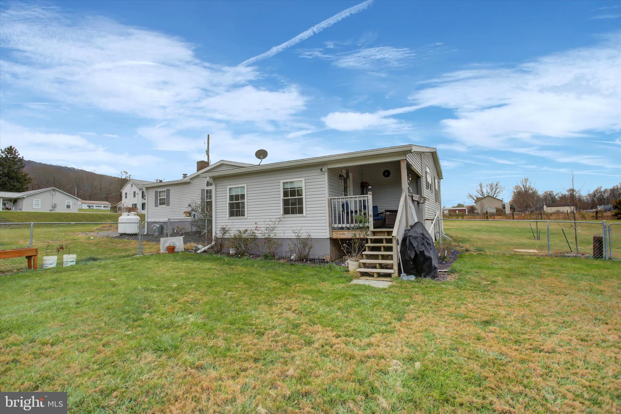 21571 Path Valley Road Dry Run, PA 17220 - Photo 45 of 63 a view of a house with a yard and sitting area