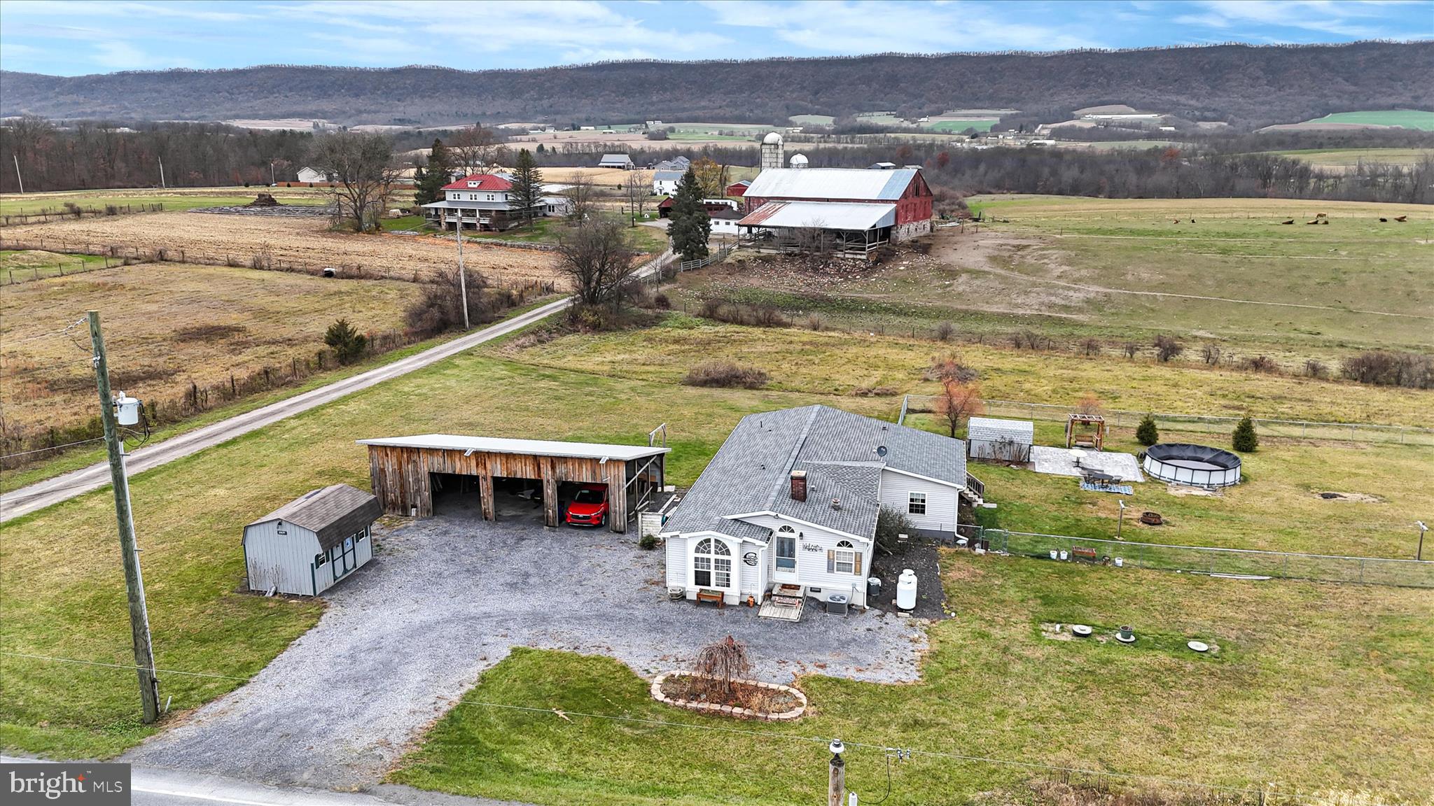 21571 Path Valley Road Dry Run, PA 17220 - Photo 58 of 63 a view of a swimming pool with a table and chairs