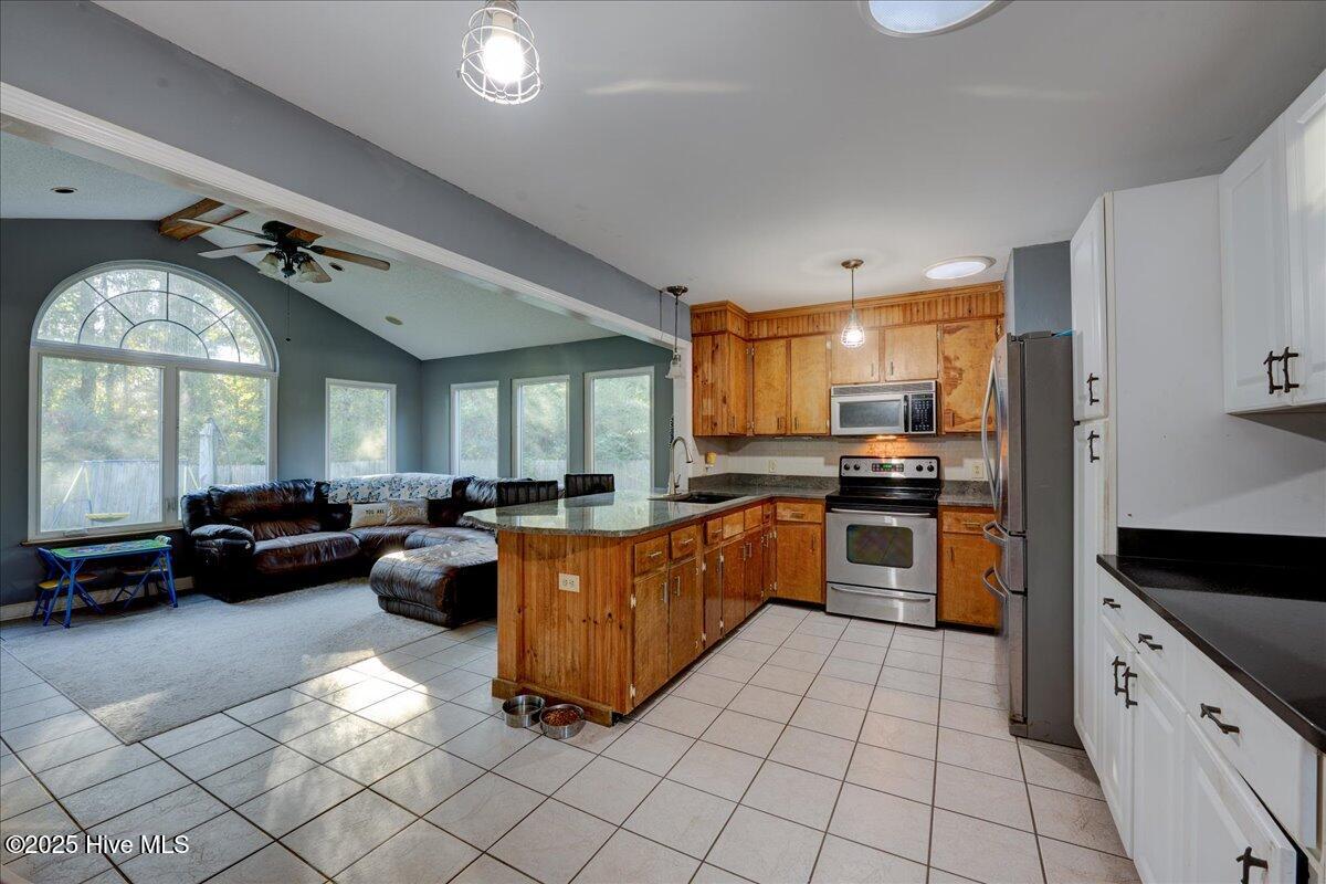 707 Clermont Road New Bern, NC 28560 - Photo 12 of 34 Open Kitchen to large sunroom/additional living room
