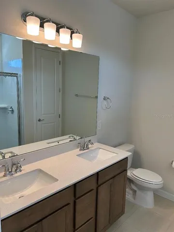 a bathroom with a sink and a toilet
