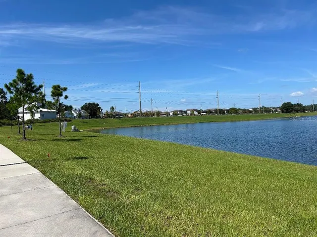 a view of a lake with a big yard