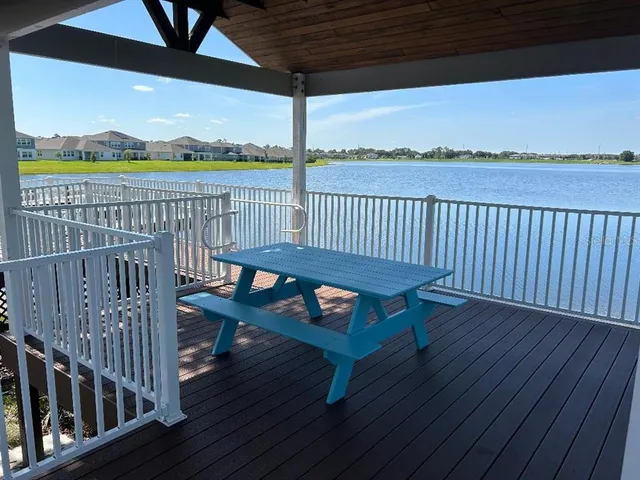 a view of a balcony with wooden floor