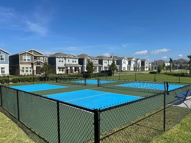 a view of a balcony with lake view and wooden floor