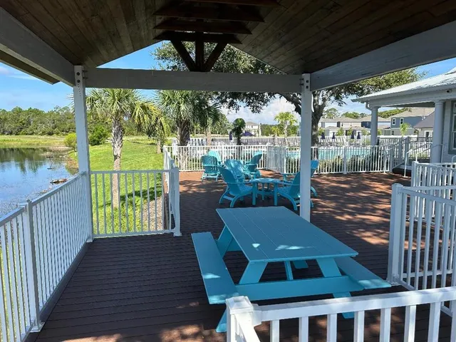 a view of wooden deck and lake view