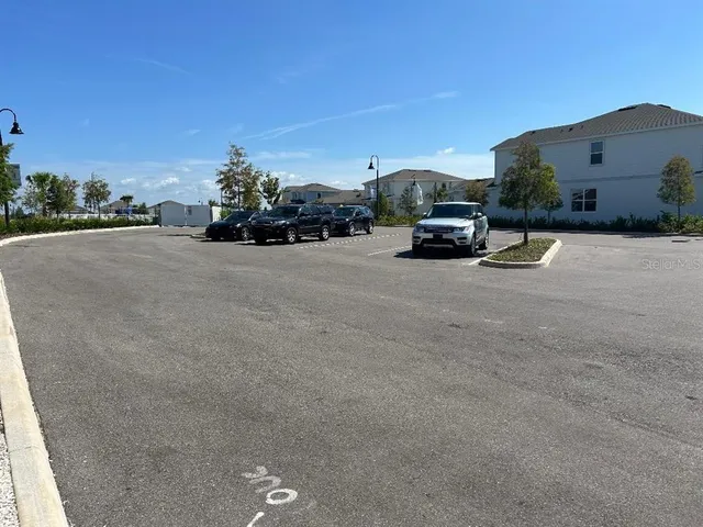 a view of swimming pool with outdoor seating and plants