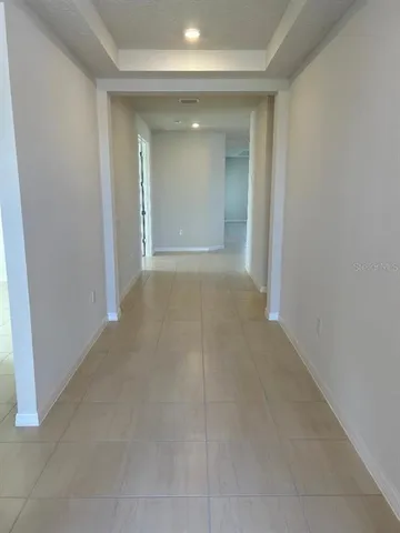 an empty room with a bathroom