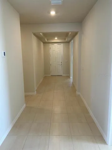 a view of hallway with a large window