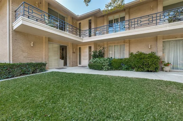 front view of a house with a garden