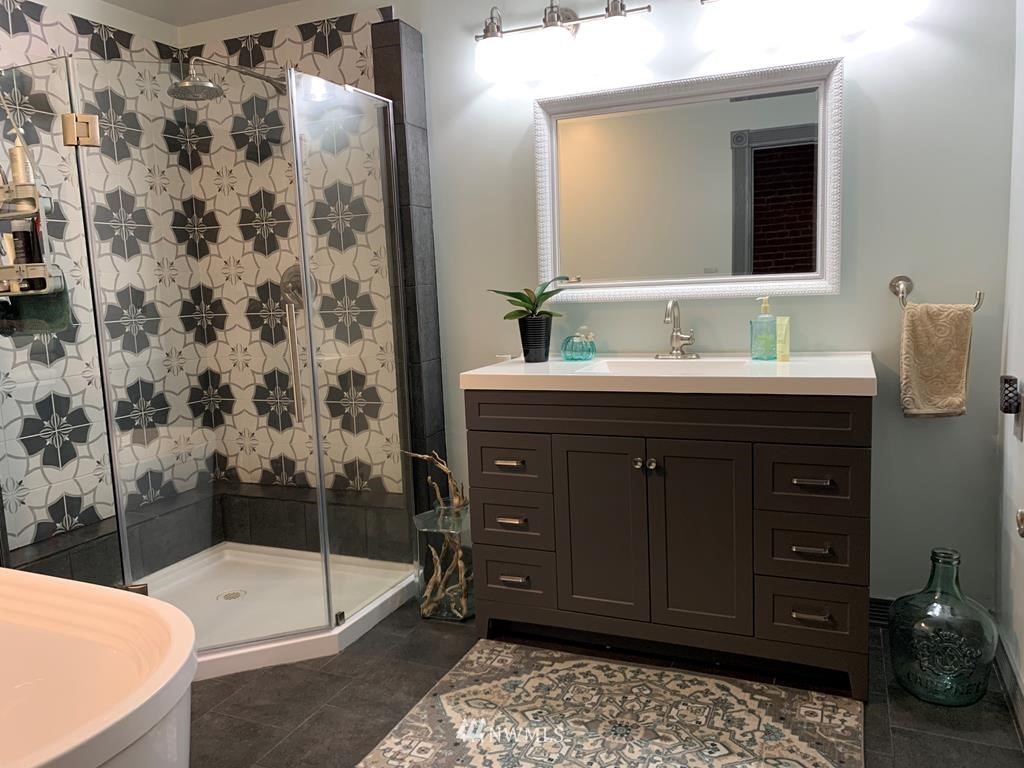 358 East Main Street Dayton, WA 99328 - Photo 12 of 34 a bathroom with a bathtub and a sink