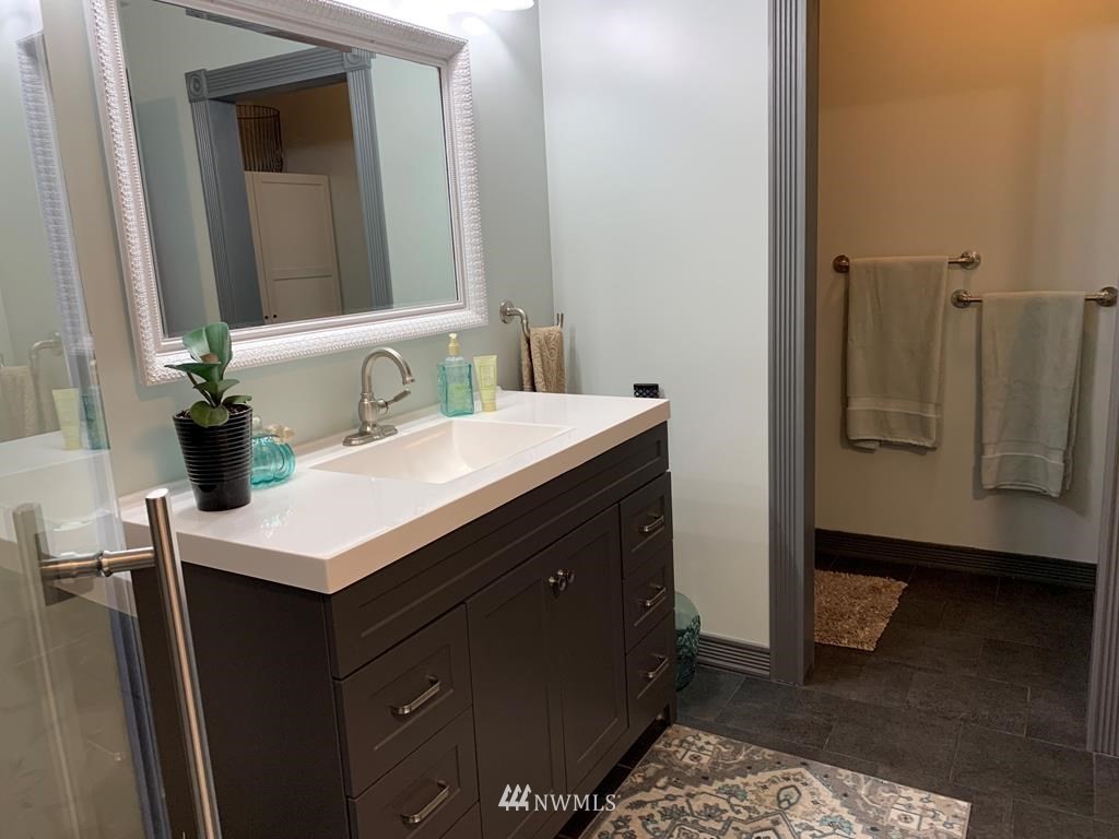 358 East Main Street Dayton, WA 99328 - Photo 14 of 34 a bathroom with a sink and a mirror