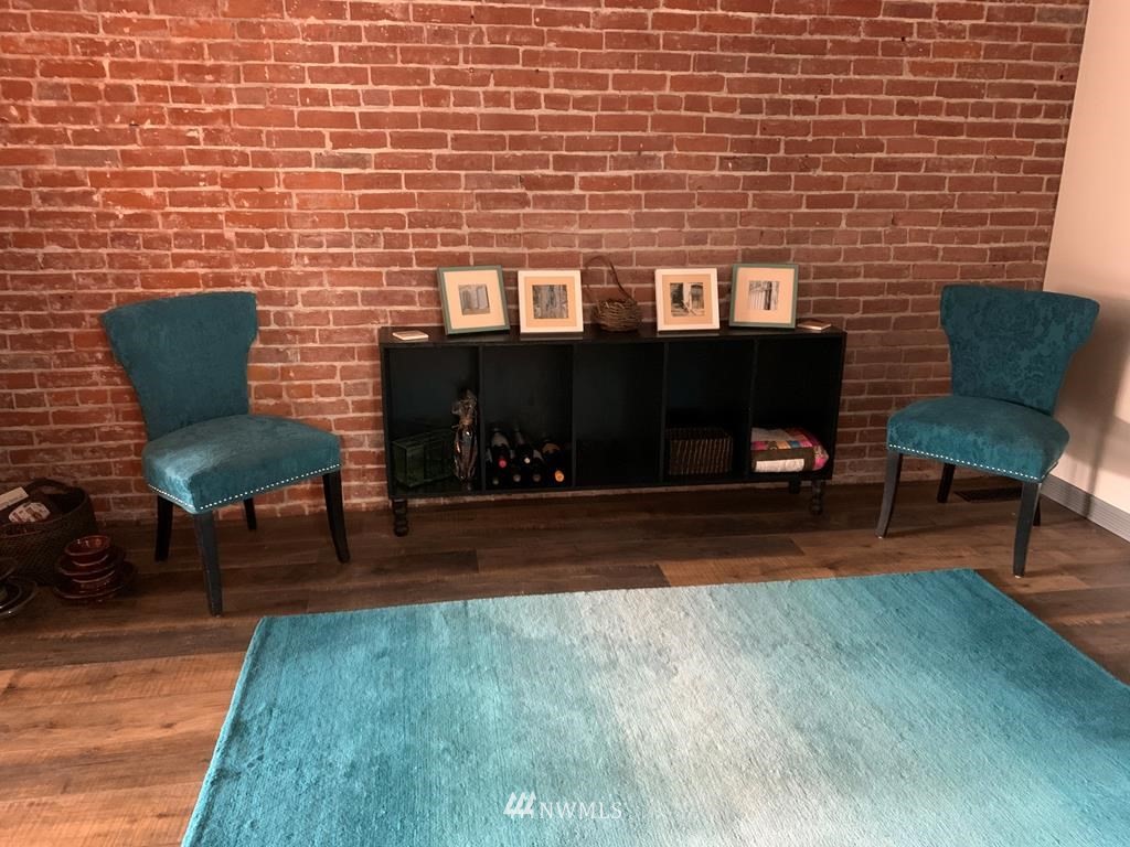 358 East Main Street Dayton, WA 99328 - Photo 18 of 34 a brick building with a bench in front of it